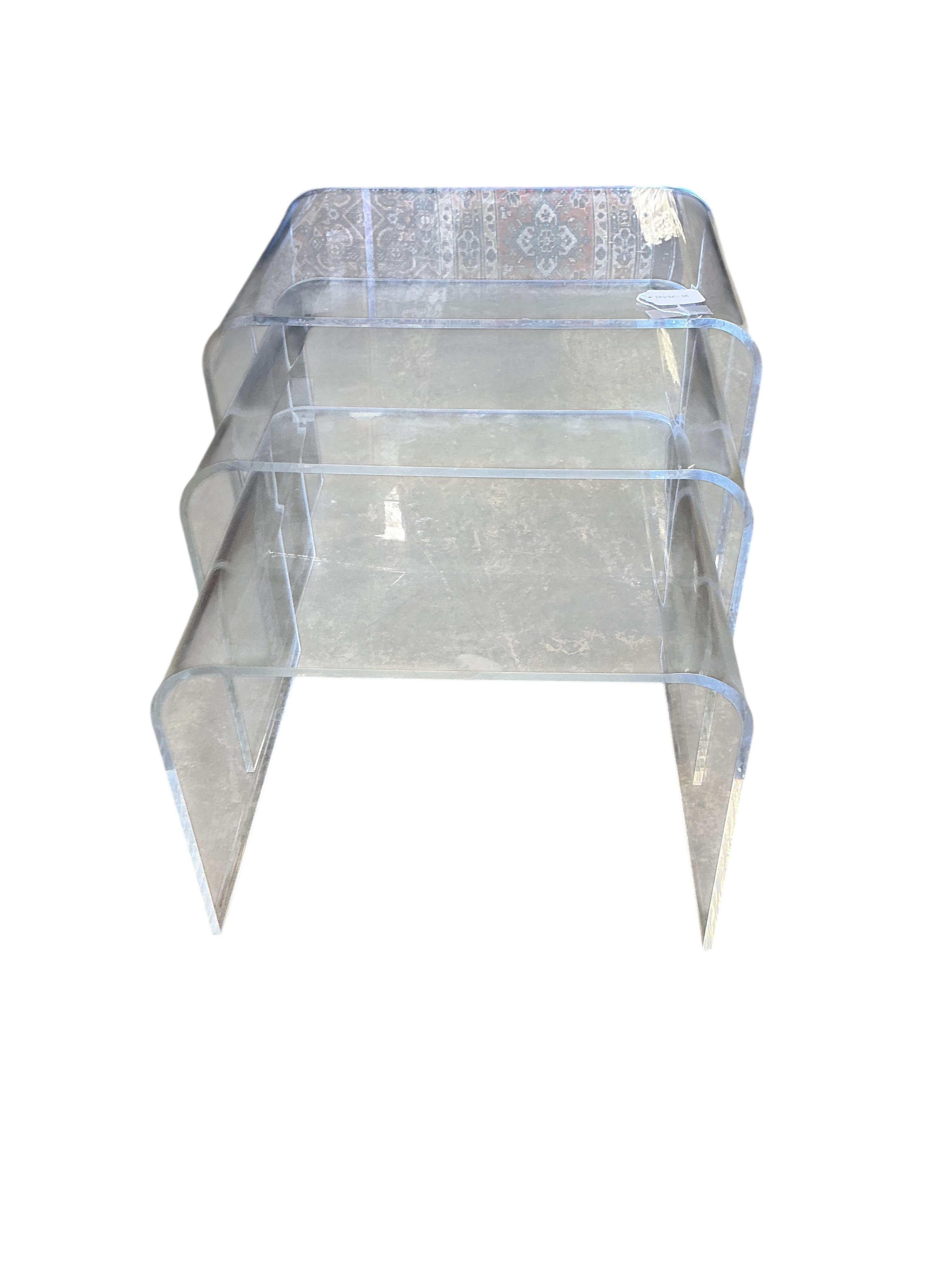 A nest of three Contemporary Perspex tea tables, width 50cm, depth 37cm, height 40cm